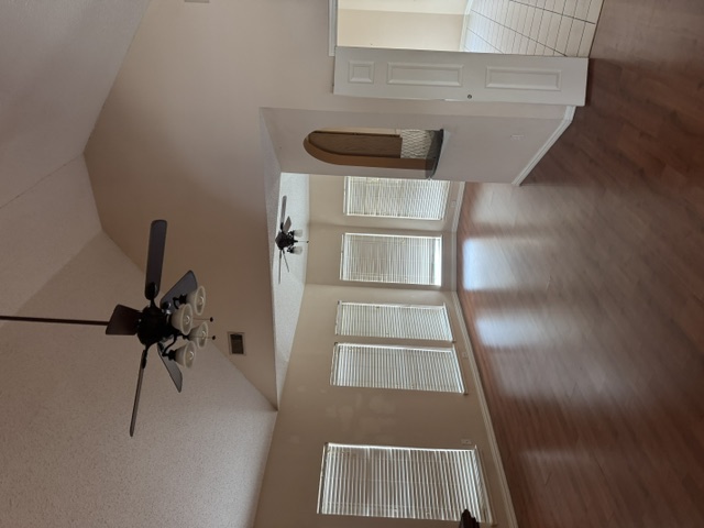 Living room with dark refinished wood flooring