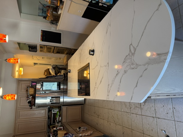 Finished kitchen remodel with quartz island by Keep n Buzy